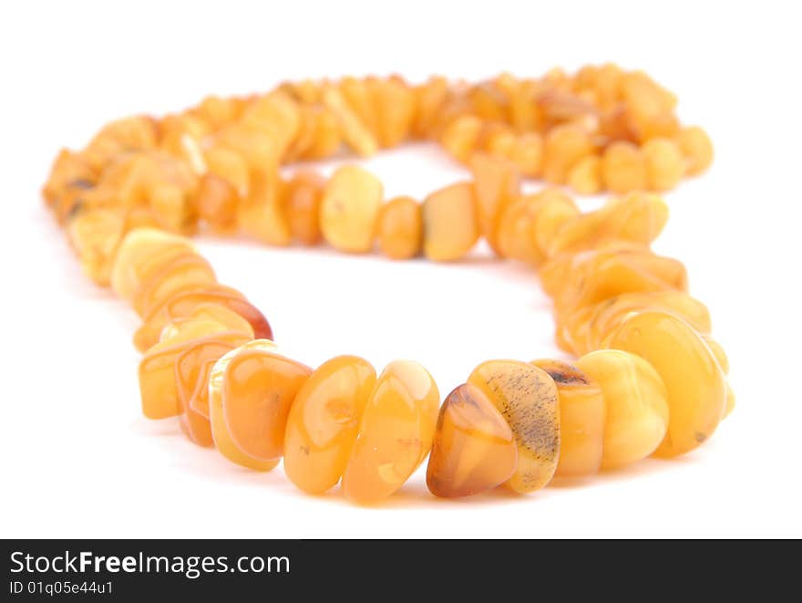 Amber necklace on a white background isolated. Amber necklace on a white background isolated