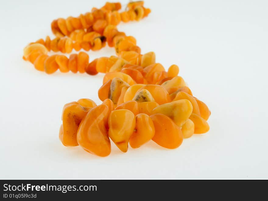 Beads, necklace of amber on white