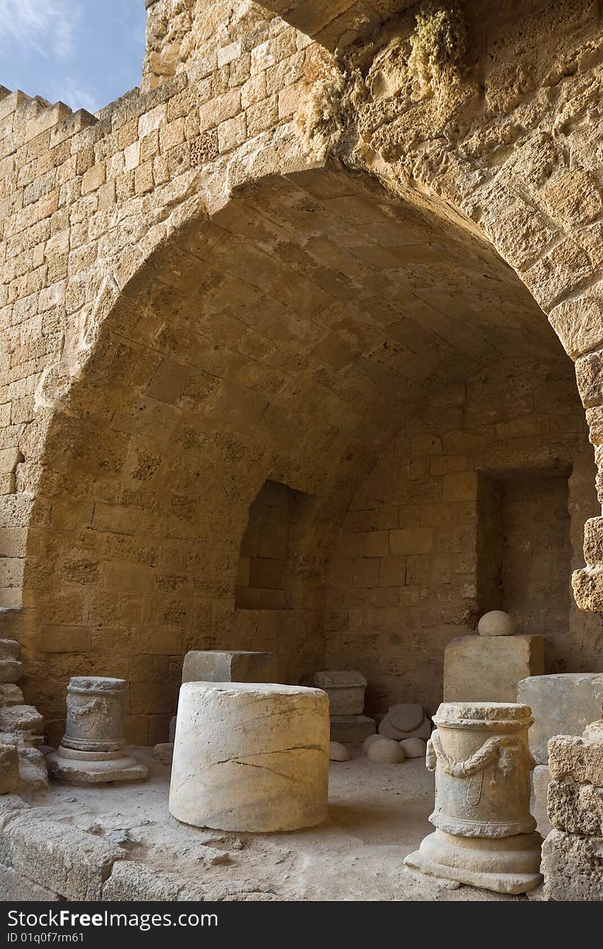 Fortress walls. Arches. A fragment in a fortress.Fortress of monks Ionitov.The city of Lindos. Island Rhodes. Greece. Fortress walls. Arches. A fragment in a fortress.Fortress of monks Ionitov.The city of Lindos. Island Rhodes. Greece.