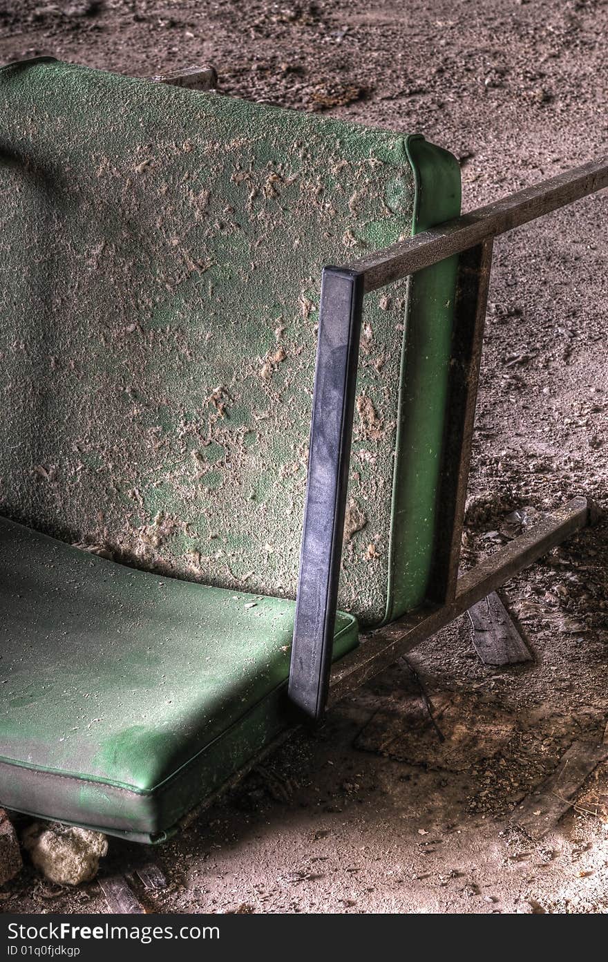 Old Green Chair in an Abandoned Building