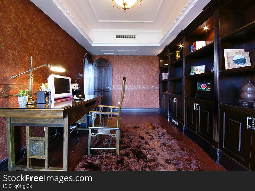 Desk and chair in den or library of a new modern home. Desk and chair in den or library of a new modern home.