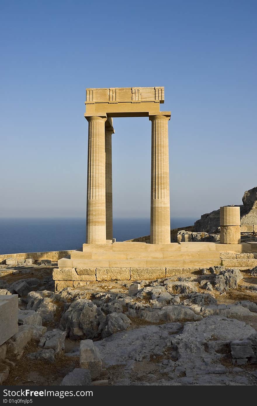 In the city of Lindos on a high rock there are ruins of an ancient acropolis. In this acropolis there was a temple of the ancient Greek goddess of Athena. Island Rhodes. Greece. In the city of Lindos on a high rock there are ruins of an ancient acropolis. In this acropolis there was a temple of the ancient Greek goddess of Athena. Island Rhodes. Greece.