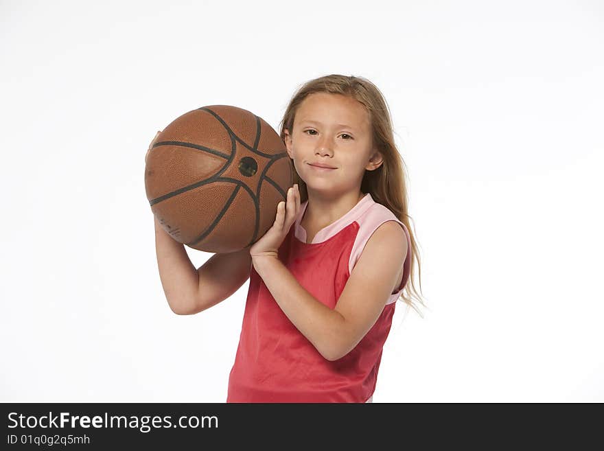 Little girl holding basketball