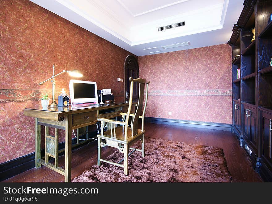 Desk and chair in den or library of a new modern home. Desk and chair in den or library of a new modern home.