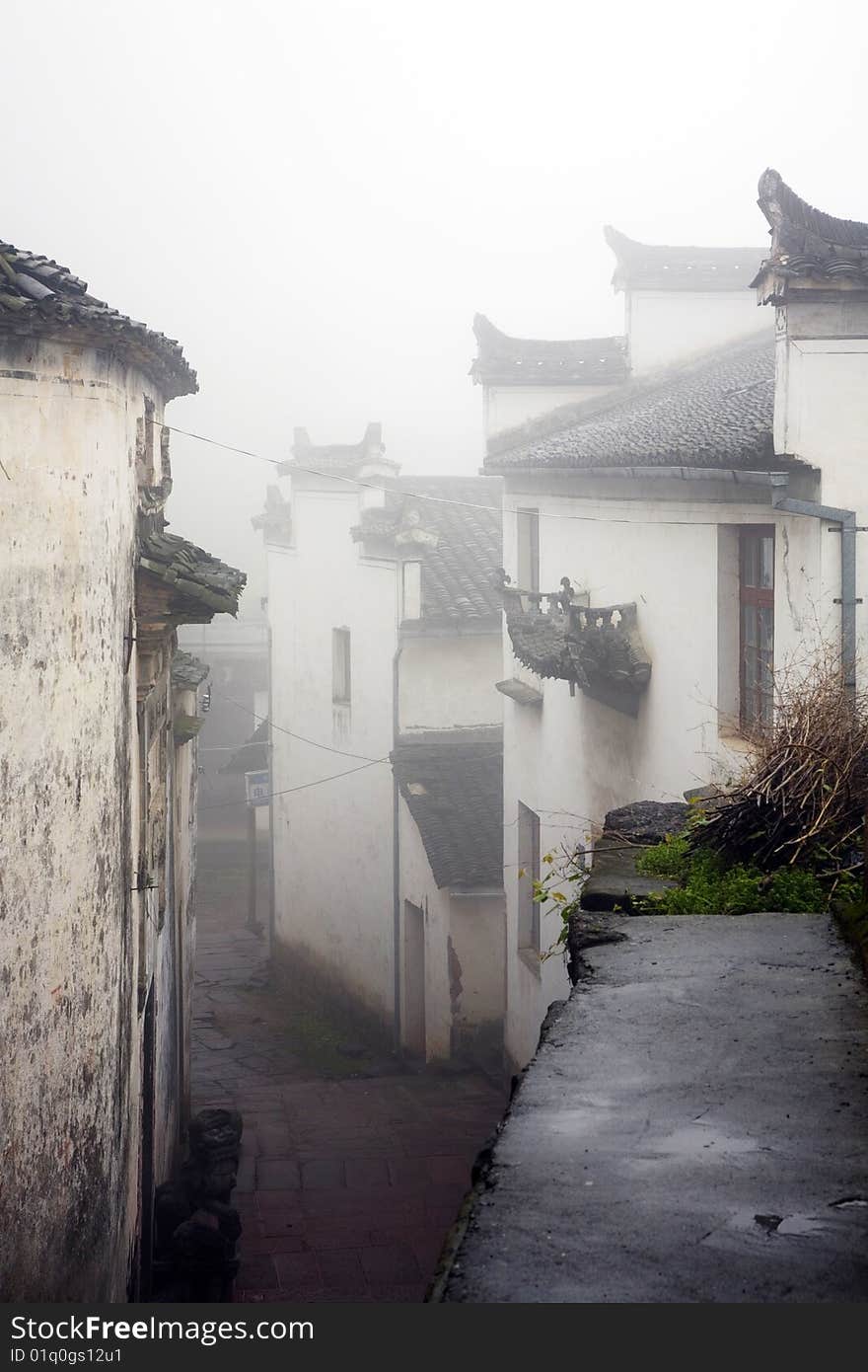 Old house in thick fog