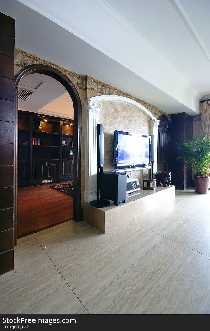 Media room in modern home with arched doorway. Media room in modern home with arched doorway.