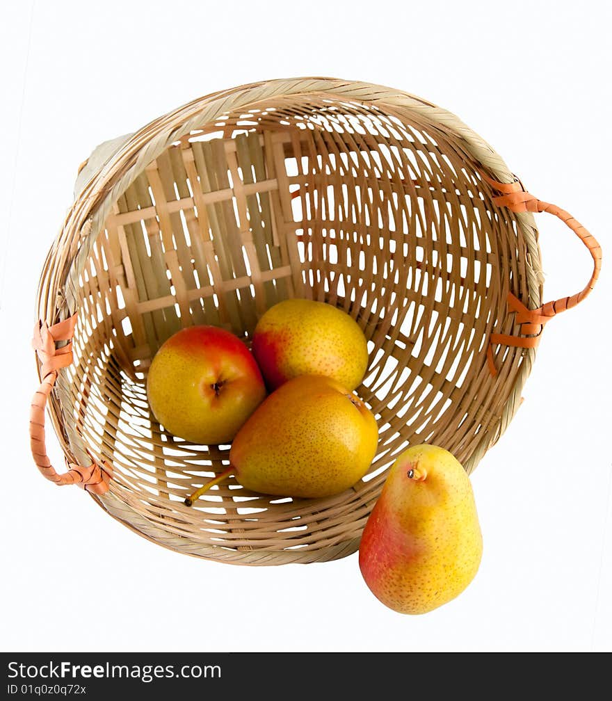 Still life of a few pears in a rattan basket isolated on white background with clipping path. Still life of a few pears in a rattan basket isolated on white background with clipping path