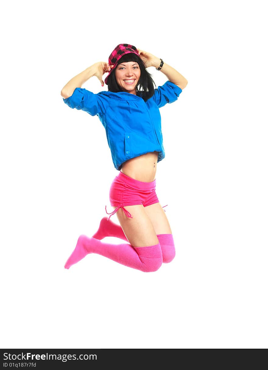 Studio portrait of a happy jumping girl wearing colorful clothes