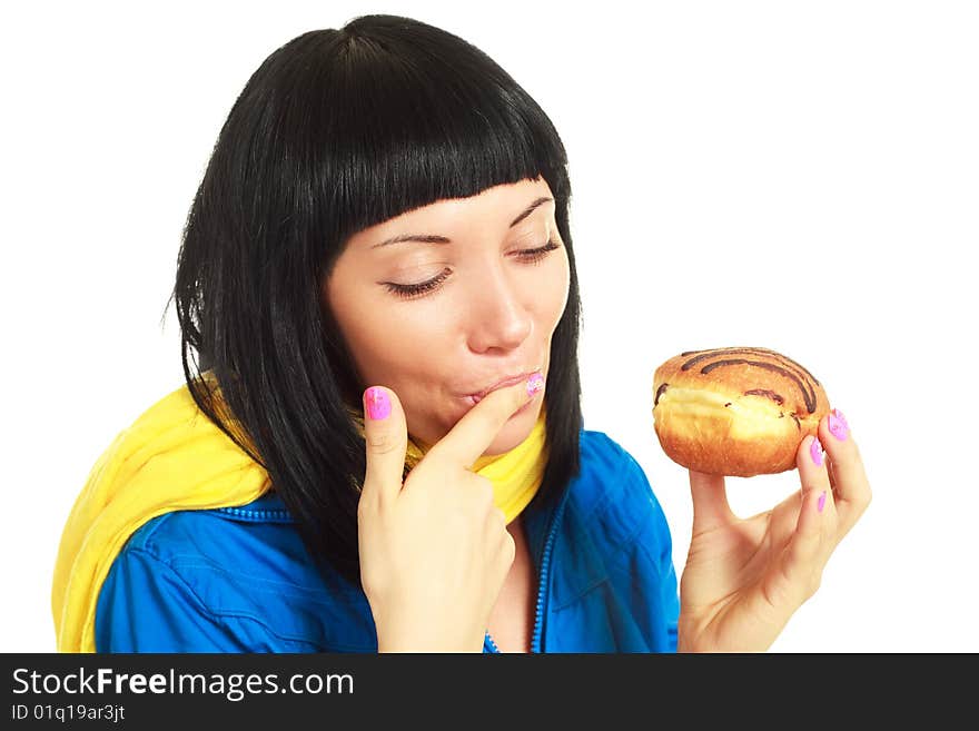 Girl eating a roll with chocolate