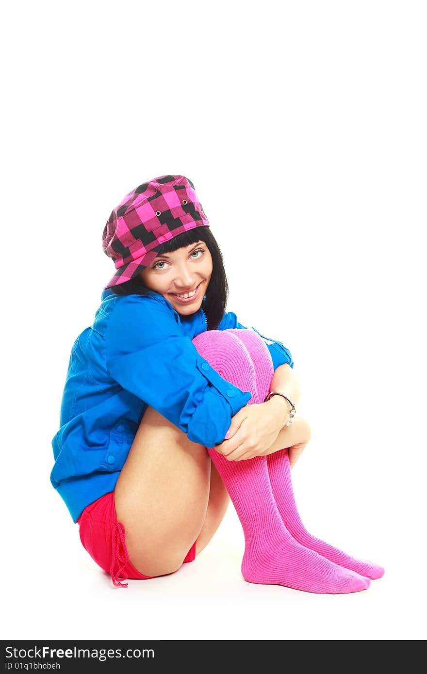 Studio portrait of a beautiful young brunette woman wearing colorful clothes. Studio portrait of a beautiful young brunette woman wearing colorful clothes