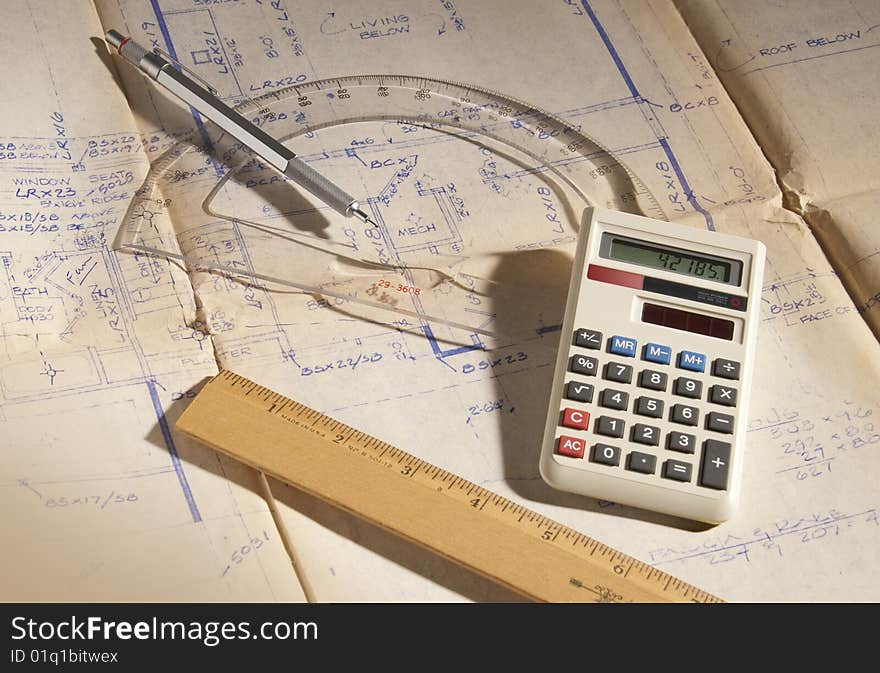 Various tools used by engineers and architects to design plans and blueprints. Various tools used by engineers and architects to design plans and blueprints