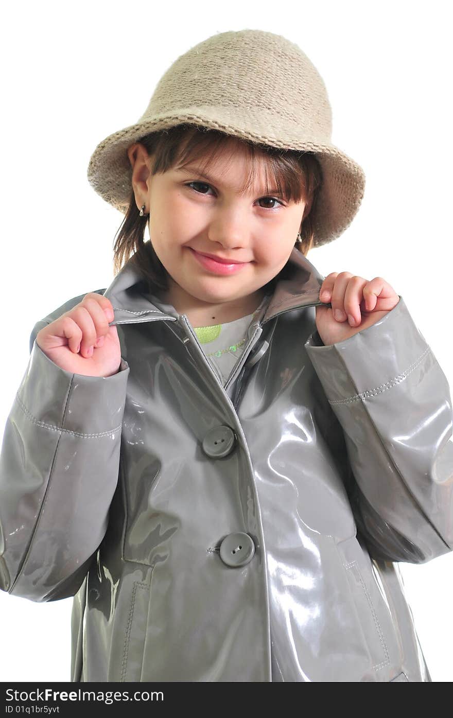 Portrait of the beautiful girl in the raincoat