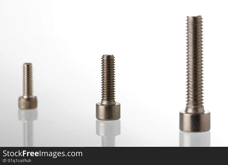 Macro of screws on bright background