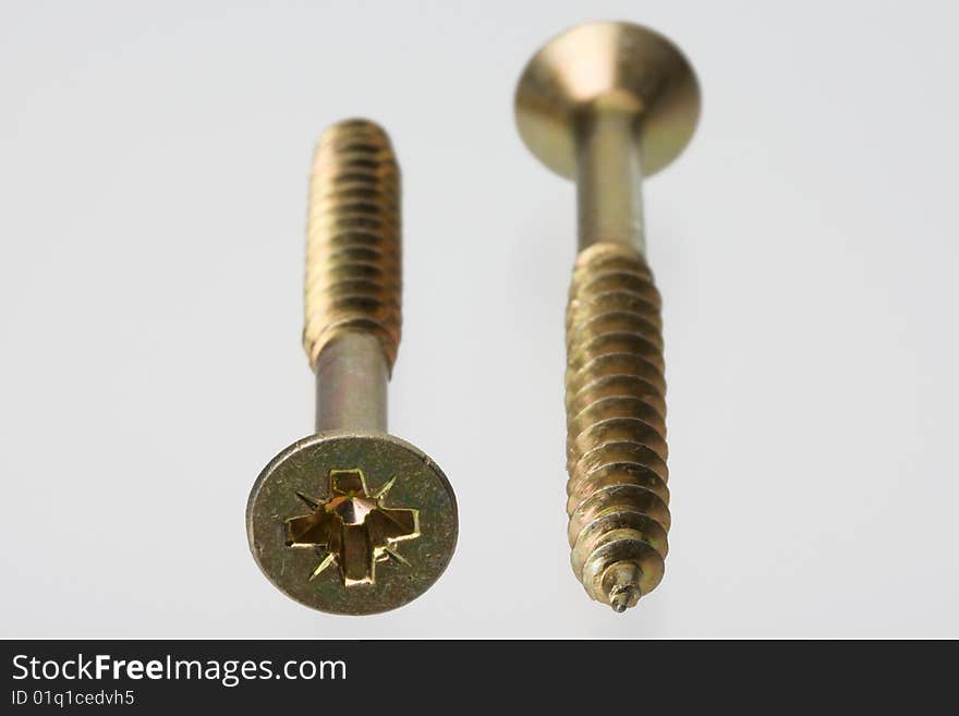 Macro of screws on bright background