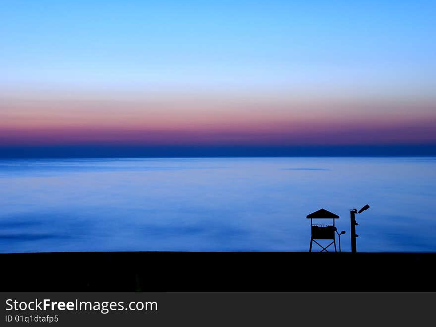 Sunset with clear blue sky and  silhouette watchtower. Sunset with clear blue sky and  silhouette watchtower