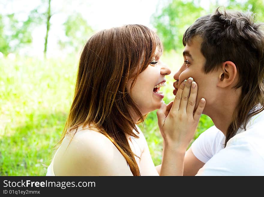 Happy young couple having fun in summer park. Happy young couple having fun in summer park