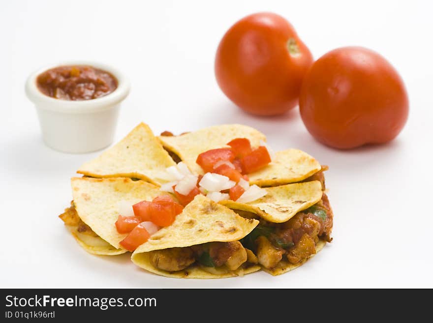 Delicious chicken quesadilla and fresh vegetables isolated