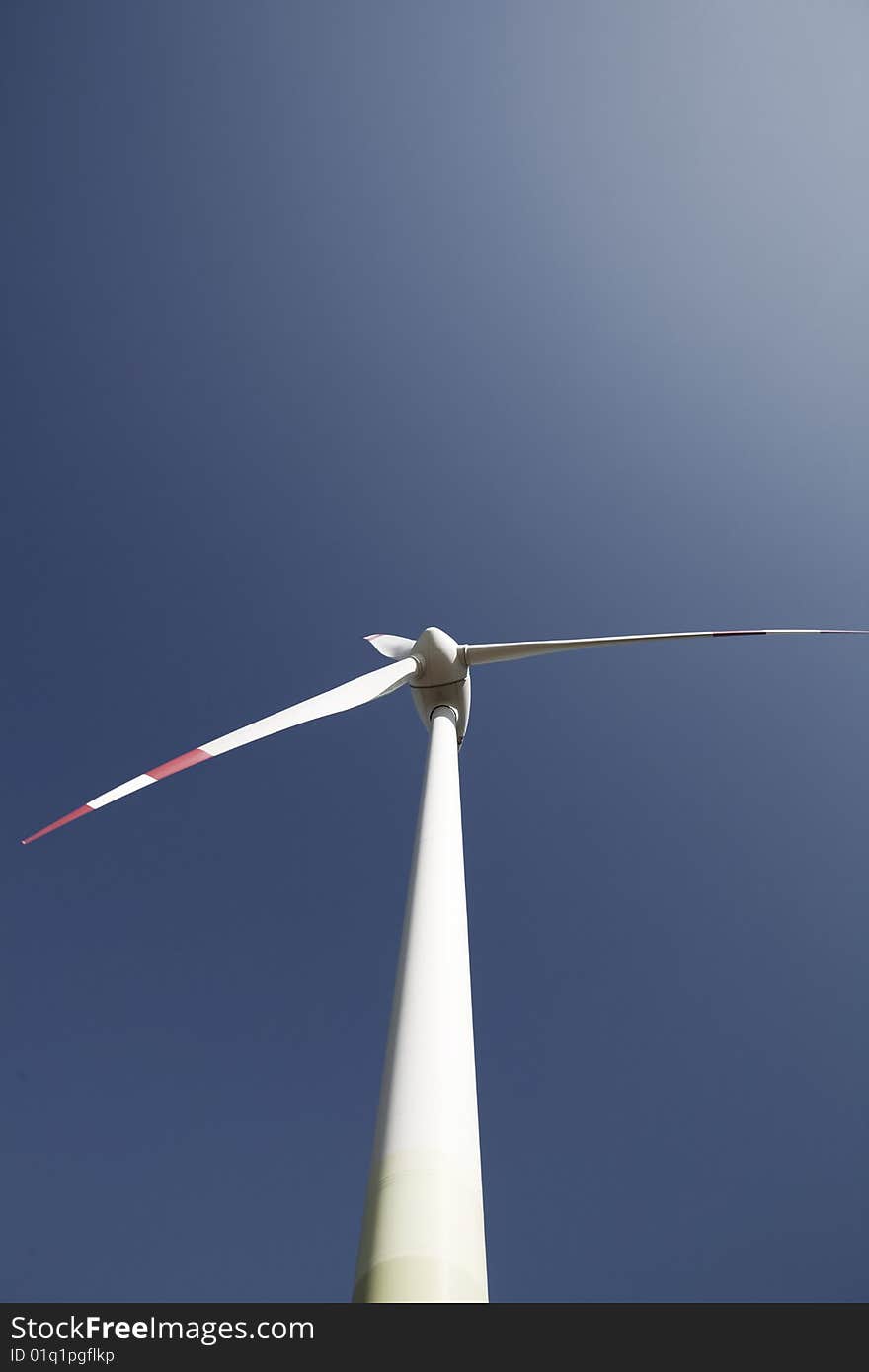 Wind turbine in the blue sky