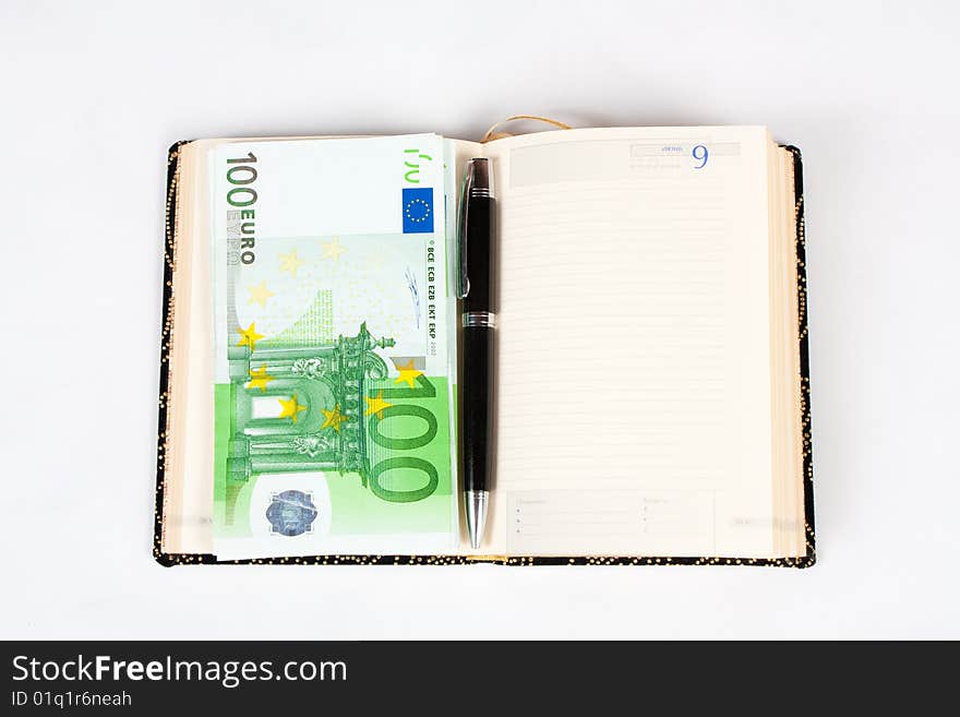 Traditional business. Organizer, pen and money. Traditional business. Organizer, pen and money.