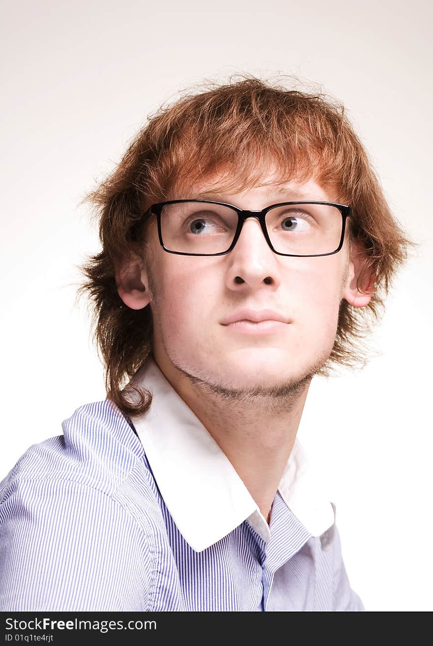 Closeup portrait of  young man in glasses