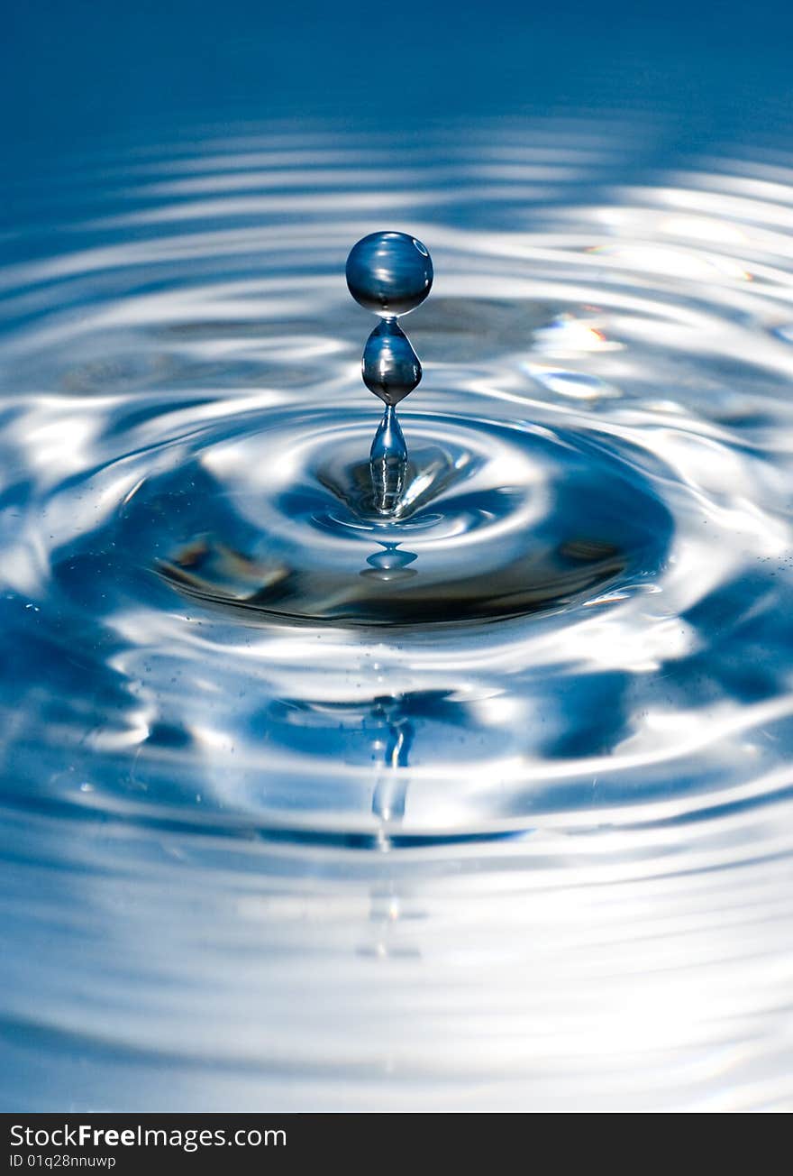 Blue water drop captured in high speed. Blue water drop captured in high speed