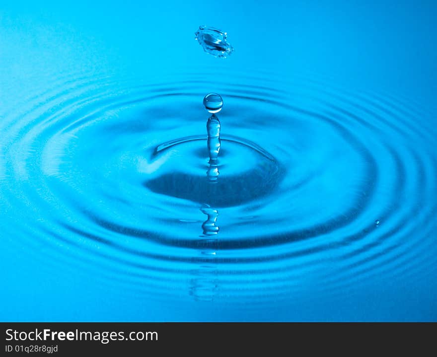 Blue water drop captured in high speed. Blue water drop captured in high speed