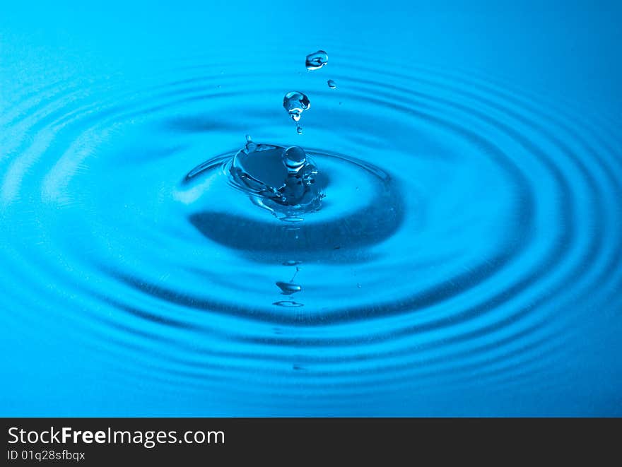 Blue water drop captured in high speed. Blue water drop captured in high speed