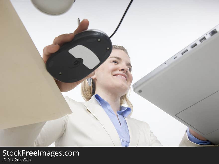 Working well: unique perspective of woman working at desk