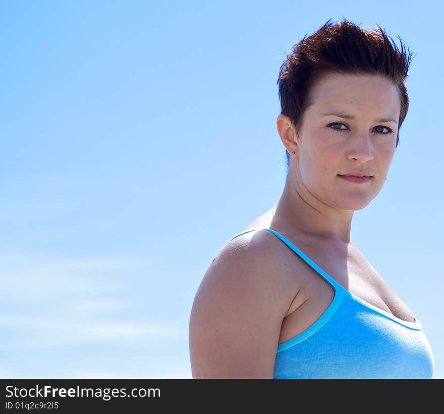 Beautiful Woman at the Beach looking at the camera