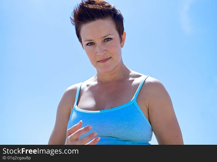 Beautiful Woman at the Beach looking at the camera