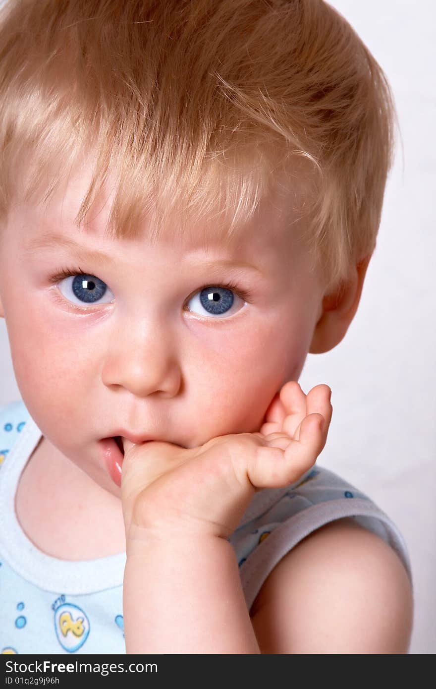 Portrait of the blond little boy on a background. Portrait of the blond little boy on a background