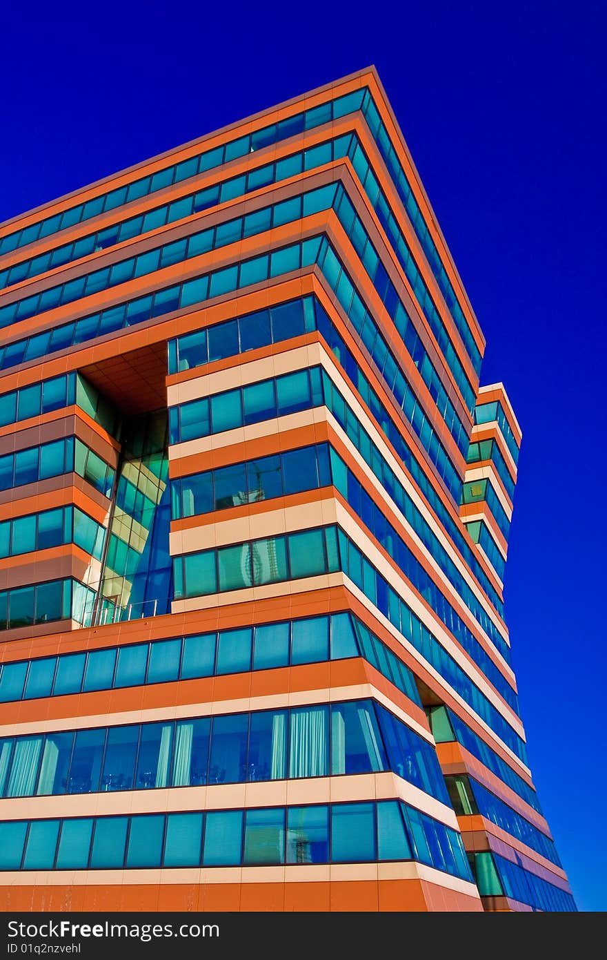 Menzis Office Building, Groningen, Netherlands. Three identical prismatic volumes, each four stories high, are rotated at 90 degrees to one another, so the building seems to lean. Menzis Office Building, Groningen, Netherlands. Three identical prismatic volumes, each four stories high, are rotated at 90 degrees to one another, so the building seems to lean.