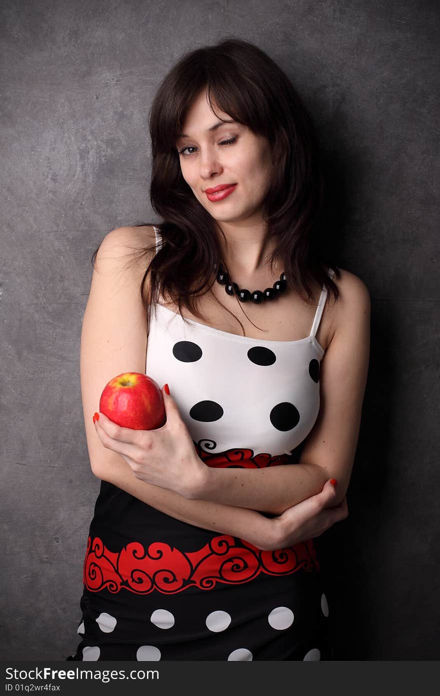 Sexual woman with a red apple