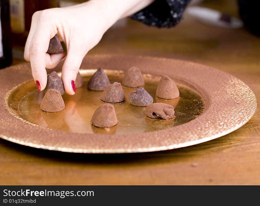 Pralines served on gold plate