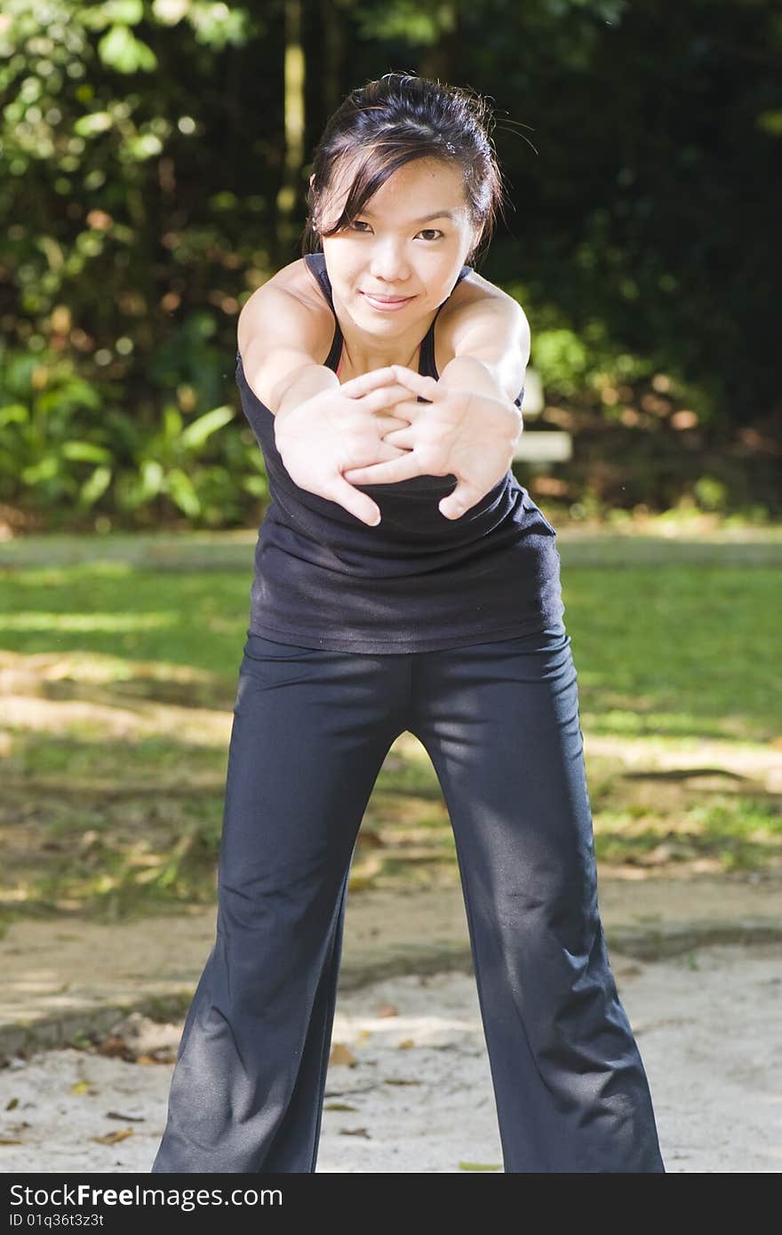 Asian girl stretching her arms