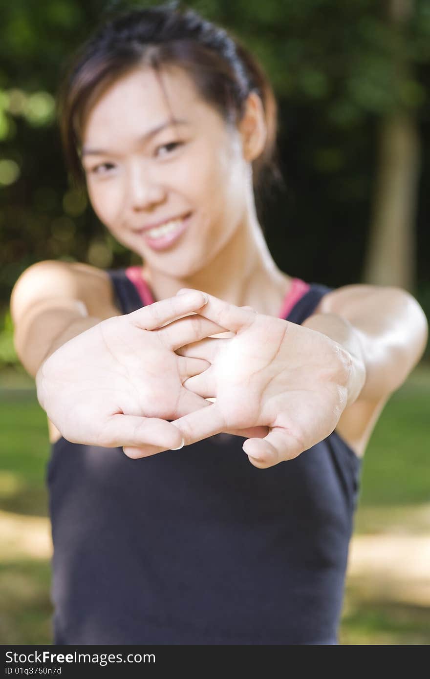 Asian girl stretching her arms