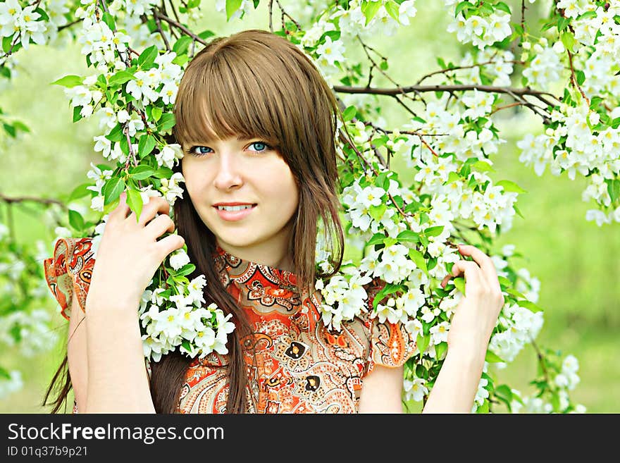 Girl among flowers