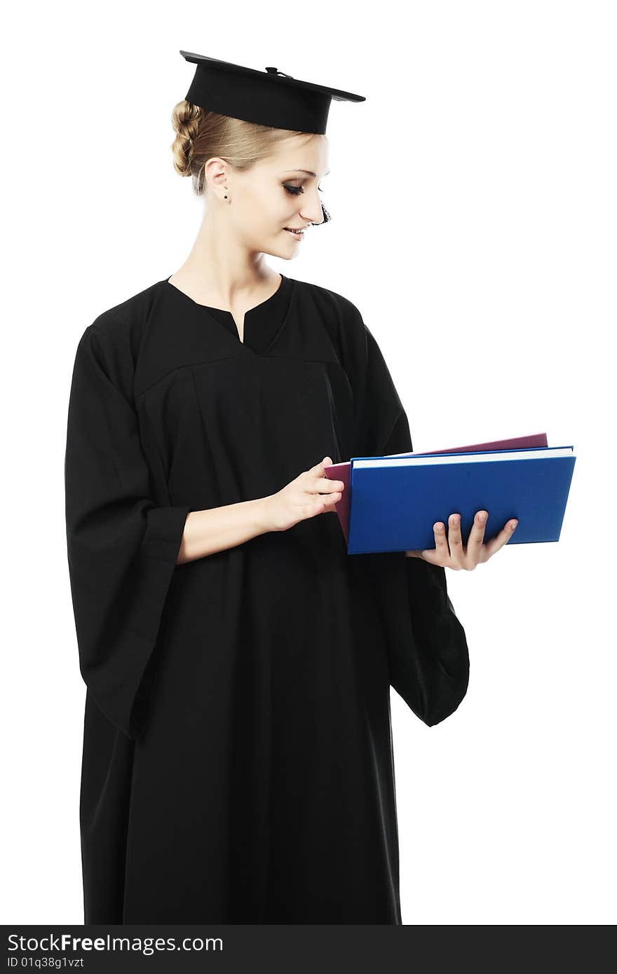 Portrait of a young woman in an academic gown. Educational theme. Portrait of a young woman in an academic gown. Educational theme.