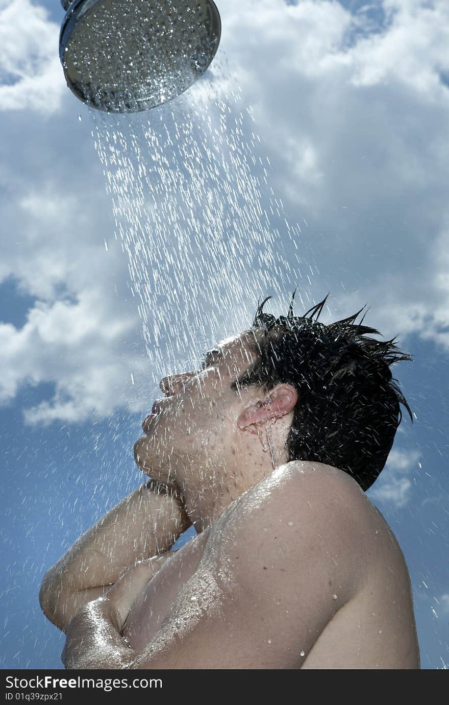 Man under outdoor shower