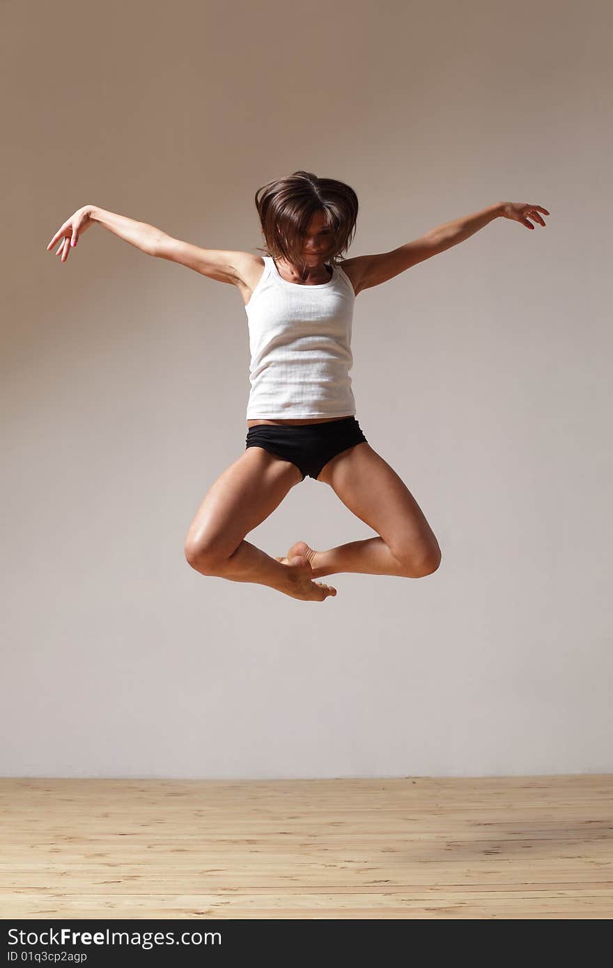 Modern style dancer posing on studio background. Modern style dancer posing on studio background