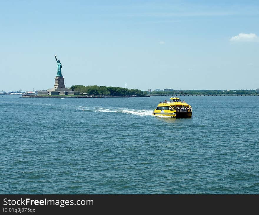 Statue of Liberty and Taxi coming from it.