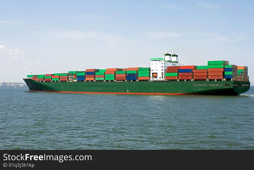 View of a ship loaded with containers. View of a ship loaded with containers.