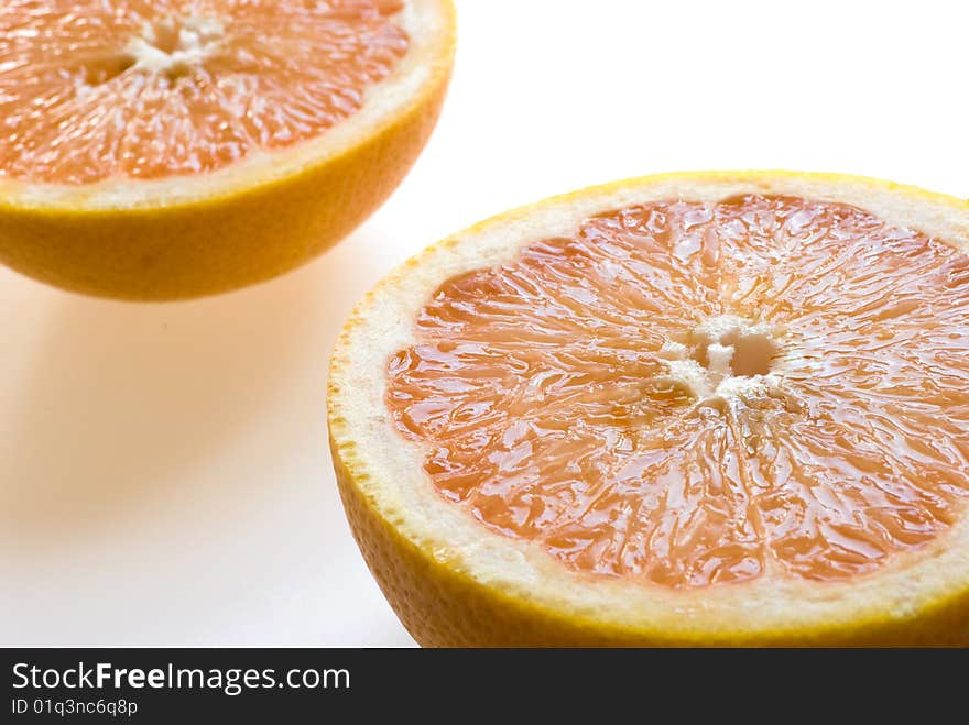 Ripe grapefruits on white background