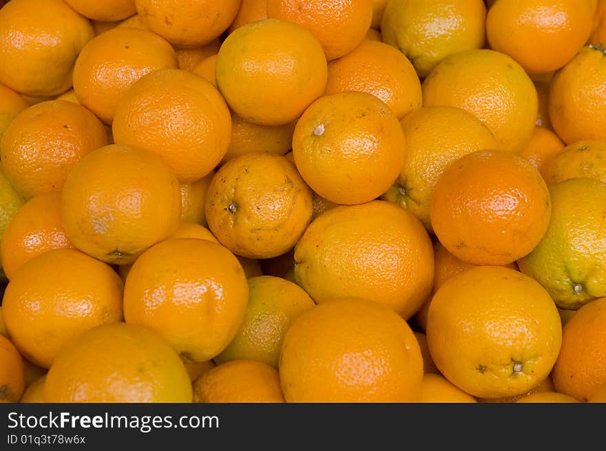 A lot of orange fruits. A lot of orange fruits