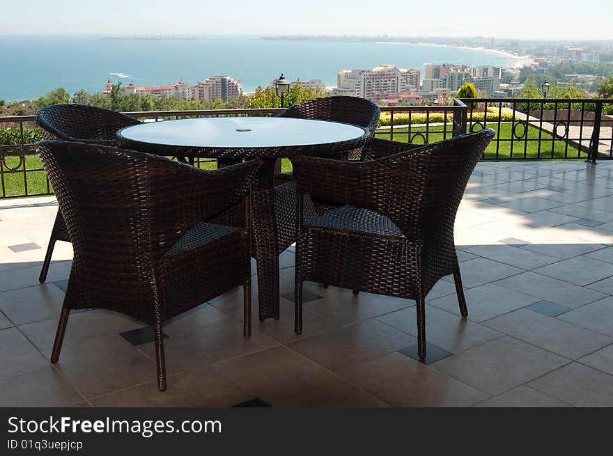 Table and chairs at restaurant with a kind on the black sea