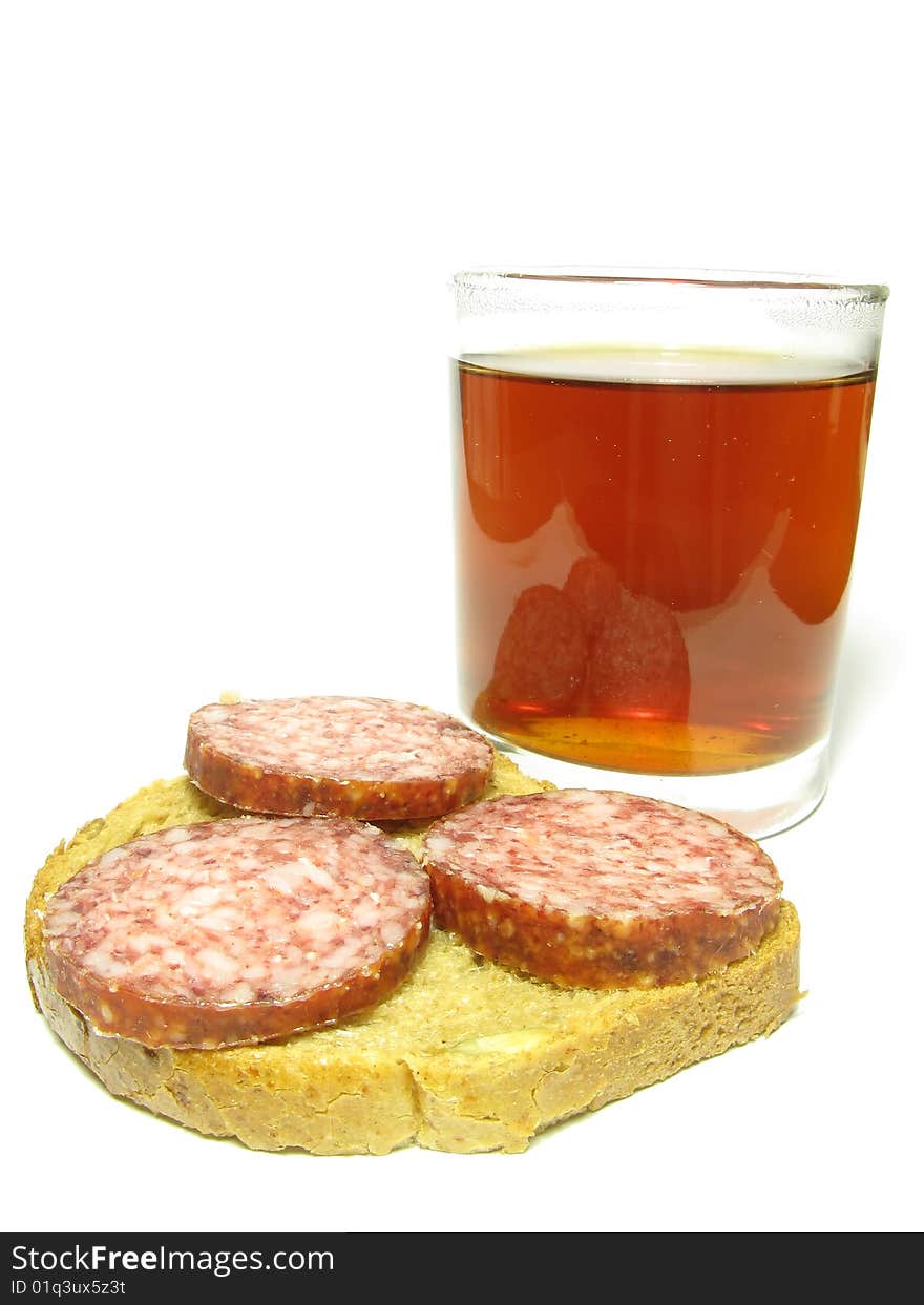 Fast food, a cup of tea and a sandwich with sausage on a white background. Fast food, a cup of tea and a sandwich with sausage on a white background.