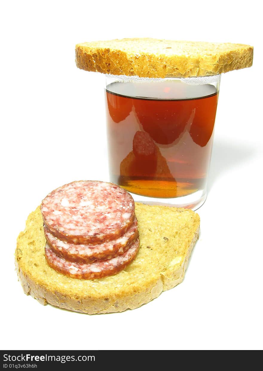 Fast food, a cup of tea and a sandwich with sausage on a white background. Fast food, a cup of tea and a sandwich with sausage on a white background.