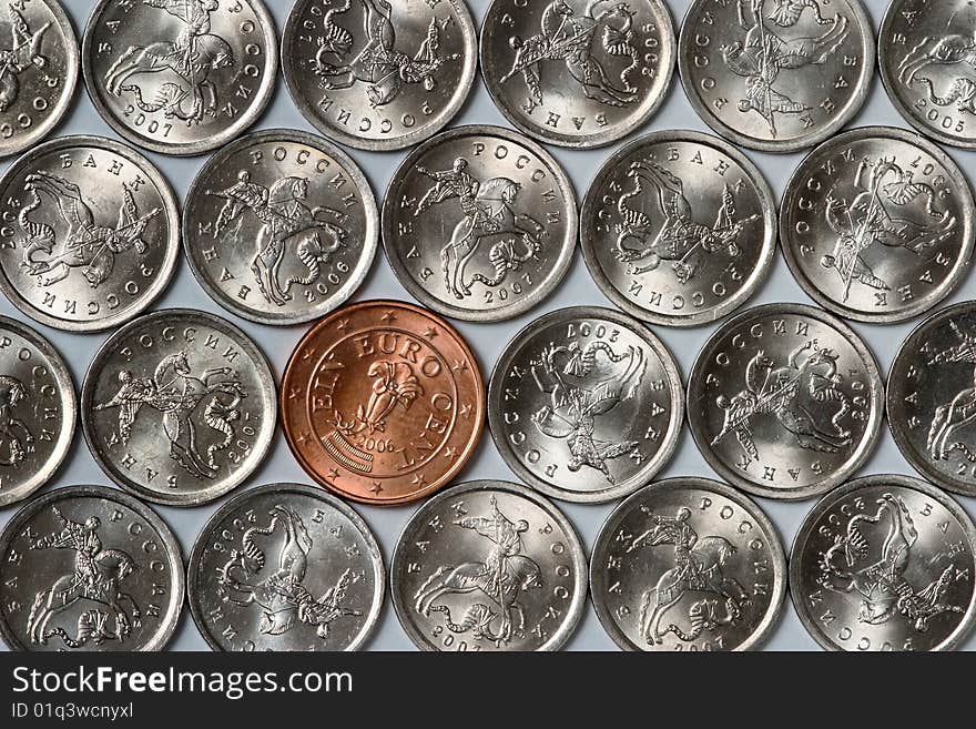 Euro coin among russian coins