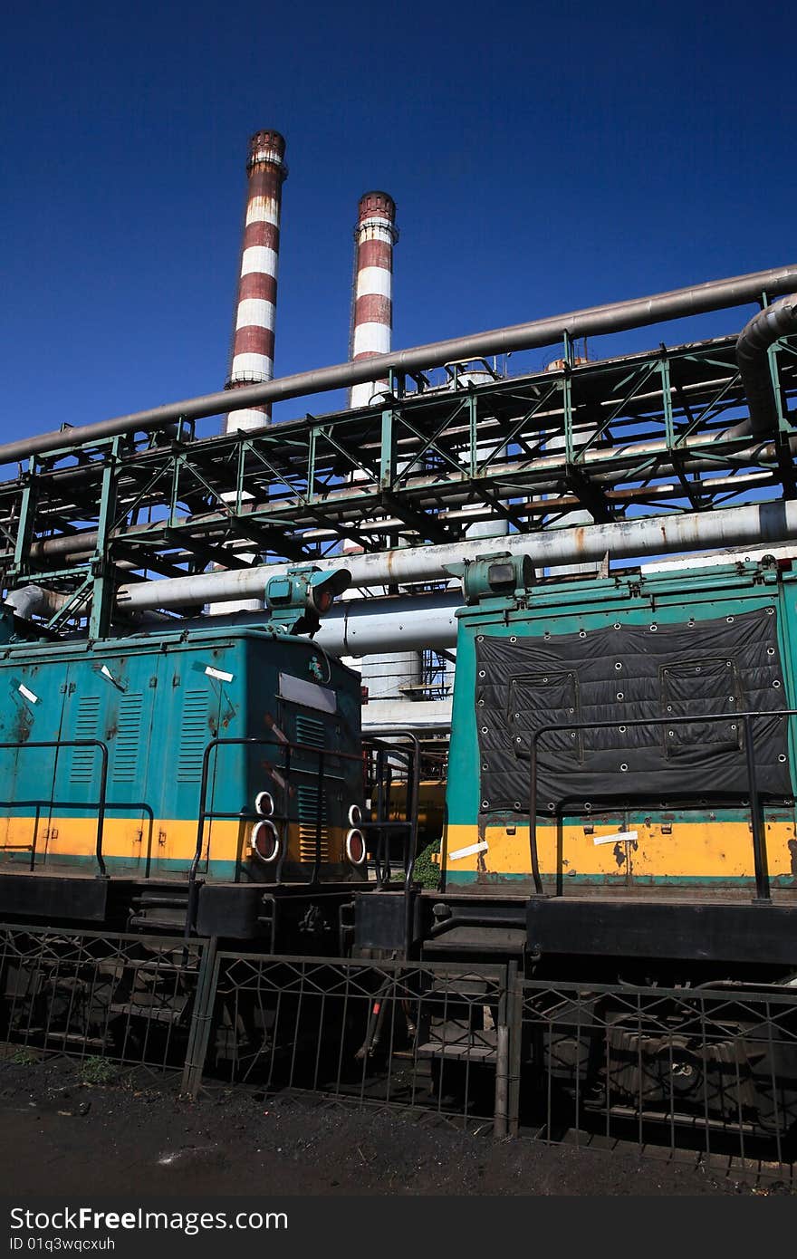 A train under 2 chimneyes at Capital Iron and Steel Plant in Beijing,China,Asia. A train under 2 chimneyes at Capital Iron and Steel Plant in Beijing,China,Asia.