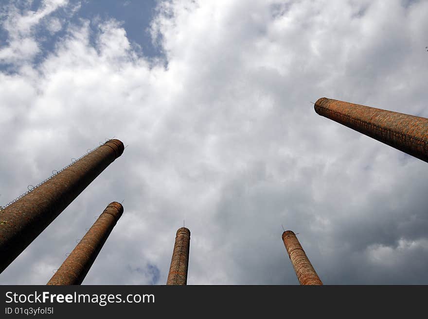 Chimneys of the old cement plant in Bedzin - town in Upper Silesia - industrial discrict of Poland